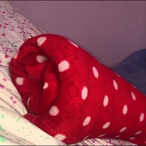 Red polka dotted throw blanket